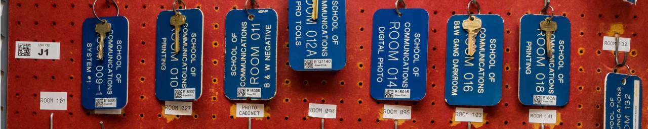 rows of keys attached to blue tags